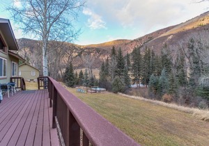 Riverside cabin with shared hot tubs, nearby skiing, fishing, and much more!