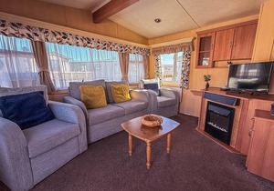 Spacious caravan for hire with decking by the beach in Suffolk ref 40094ND