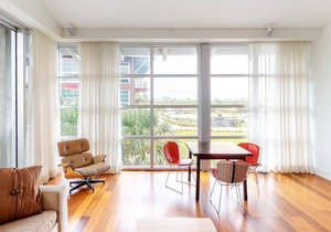 Stylish coastal condo w/ shared pool, floor-to-ceiling windows & free WiFi