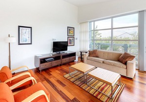 Stylish coastal condo w/ shared pool, floor-to-ceiling windows & free WiFi