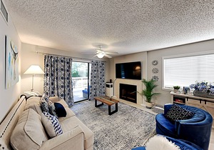 Stylish home with oversize deck & updated kitchen - walk to beach, pools, & gym
