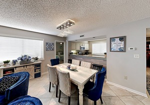 Stylish home with oversize deck & updated kitchen - walk to beach, pools, & gym