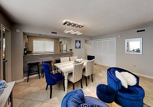 Stylish home with oversize deck & updated kitchen - walk to beach, pools, & gym