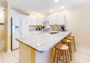 Sunny condo w/balcony, water views, shared outdoor pool + kiddie pool