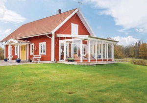The cottage has an open floor plan and is located in the countryside.