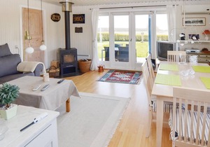 The cozy cottage is located close to the popular swimming beach of Tørresø, which allows adults and
