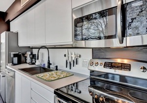 This fully updated, three-story contemporary townhome is the perfect spot for business or a getaway