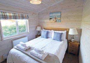 This Lodge is nestled in woodlands and comprises of two double rooms and two twin rooms.