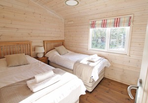 This Lodge is nestled in woodlands and comprises of two double rooms and two twin rooms.
