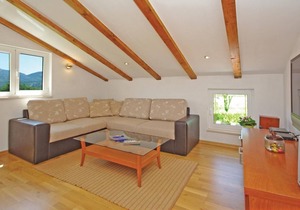 This tastefully furnished cottage, surrounded by nature, consists of two living units connected by e