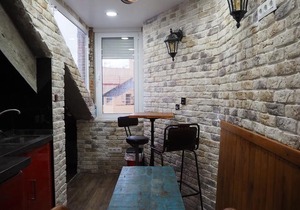 Tiny and cute apartment in the roof touching border