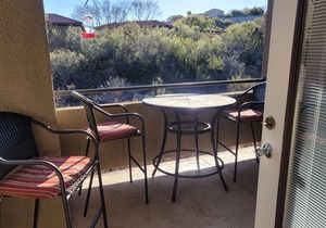 Tucson flair in this 2nd floor-serene patio -close to main pool- exercise rm