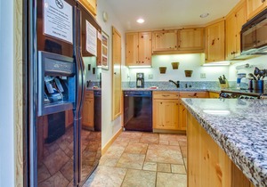 Two-level, forest-view condo with deck - steps from the Village & Ski Back Trail