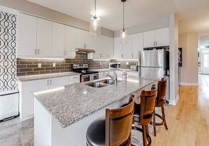 Two-story condo with patio, fireplace, grill, & heated pool - dog-friendly