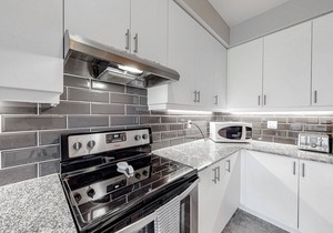 Two-story condo with patio, fireplace, grill, & heated pool - dog-friendly