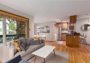 Updated, bright & cozy corner unit with private bike/ski storage and free parking