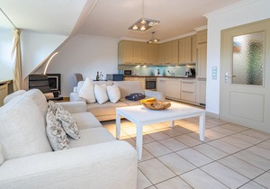 Vacation apartment under thatch for up to 4 people with sunbathing area.