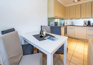 Vacation apartment under thatch for up to 4 people with sunbathing area.