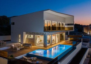 Villa Ramarin 1 with heated pool, jacuzzi and sauna by the sea in Rogoznica