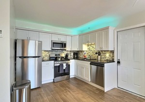 Walk to the Beach and More from this Fully Renovated Unit W/Heated Pool