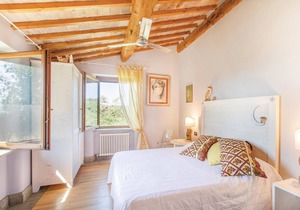 Well-maintained and elegant part of a two-family house with extensive garden and pool, about 10 km f