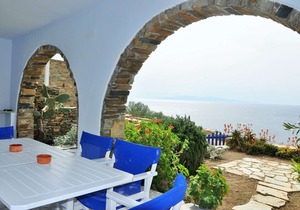 Windmill and houses by the sea / Stavros Bay