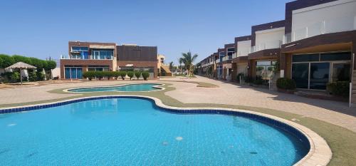 Al Kura Apartment | شالية منتجع ارض السعادة 1