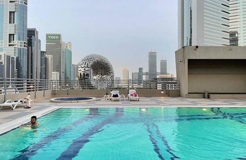 Trade Center Apartment | 1-bedroom with WiFi and fitness room with a shared living area in downtown Dubai