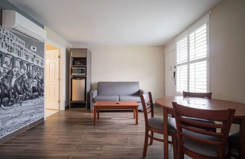 Ocala Hotel | 1 Queen Suite at Equus Inn, Pets Allowed, Seasonal Pool, Free Breakfast