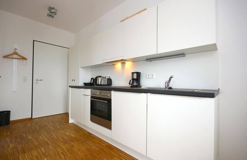Horum Apartment | 1-room vacation apartment with beautiful terrace - only 100 m to the North Sea beach! -
