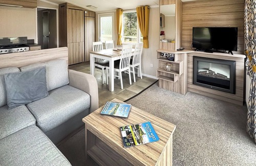 Castle Douglas House | 12ft-wide caravan situated in a coastal position.