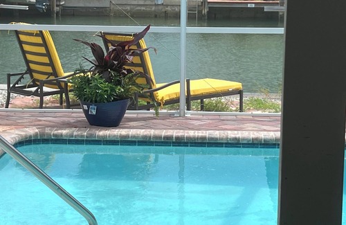 Isles of Capri House | 2 bedroom home located on a canal on Isles of Capri. Heated pool with boat dock