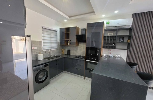 Santeo House | 2 bedrooms with WiFi AC in lovely Adenta Municipality Starlink Solar - Unit #1