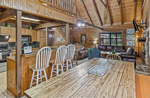 Rockport Cabin | 2-story cabin with an enclosed yard, patio, and large shade trees