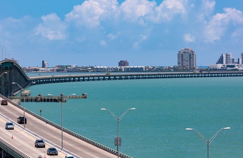 South Padre Island Condo | 2-story condo with on-site pool & pool views - private balcony & washer/dryer