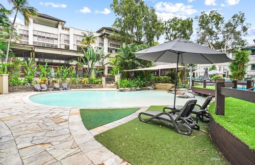 Palm Cove Apartment | 235 Temple Tranquility: Triton Retreat- Luxury Studio in Palm Cove | Private Stay with Resort Pools & Balcony