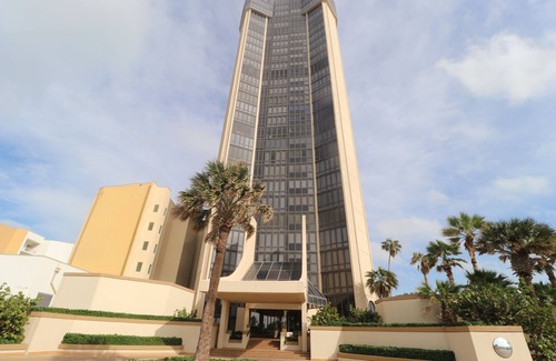 South Padre Island Condo | 4 BR Oceanfront Oasis: Luxury Amidst the Bustle w Heated Pool & Private Balcony