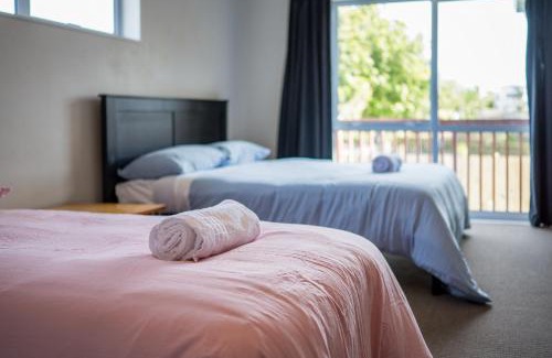 Browns Bay House | 7BR 3BH Beach Escape. 2 min to Browns Bay Beach