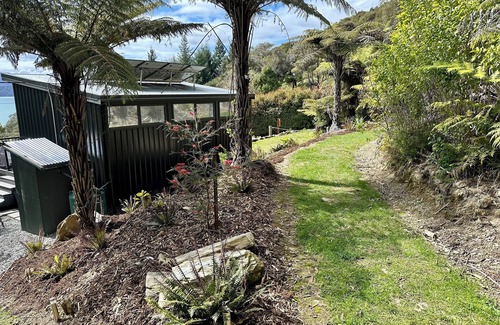 Moetapu Bay Cabin | A cosy two bedroom off-grid cabin, the perfect place to rest, relax & recharge.