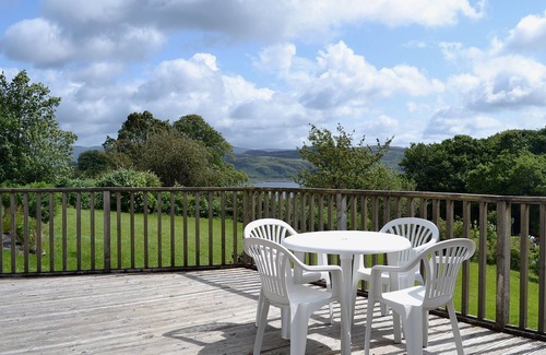 Tighnabruaich Cottage | A detached wooden bungalow, on an open elevated position facing east out to the Kyles of Bute.