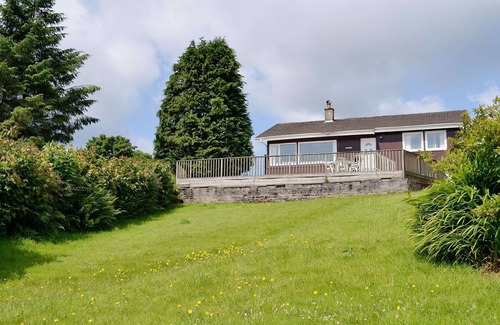 Tighnabruaich Cottage | A detached wooden bungalow, on an open elevated position facing east out to the Kyles of Bute.