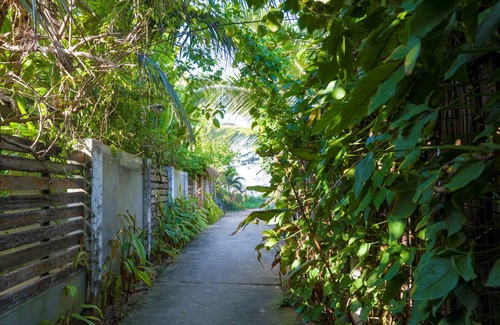 Cam An Villa | A hidden oasis villa along a narrow path 50 paces from white sand beach.