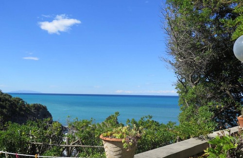 Rosignano Marittimo House | A house directly on the sandy beach with rocky coast, dreamlike object, view unique