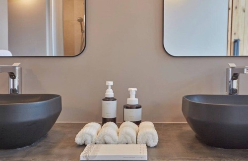 Karimata House | A luxurious inn with a coralcolored interiorEmer / Miyakojima Okinawa