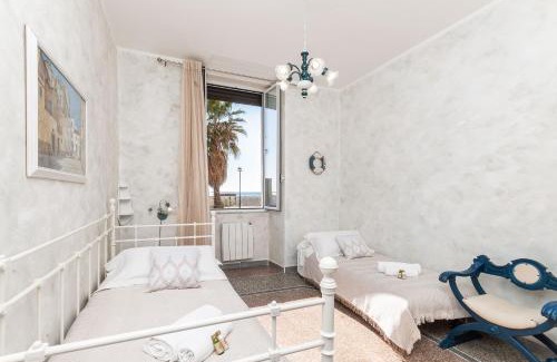 Savona Apartment | A Spiaggia, Seafront with the sand 10 steps away