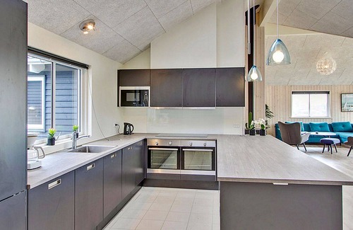 Vejby House | Activity house on a large lawn with pool and XL kitchen