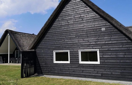 Toftum House | Activity house under thatch with pool, whirlpool, sauna and activity room