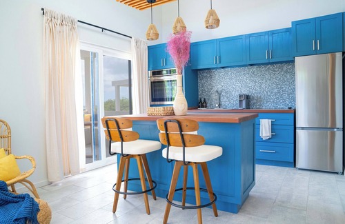 Saint George Parish Cottage | Affordable luxury, with runway views and tropical breeze.