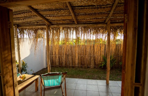 Tofo Apartment | Air conditioned en suites with King size beds and mini fridges with verhanda