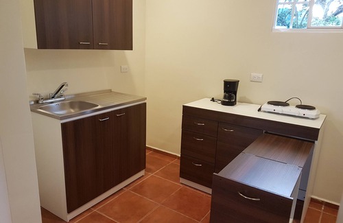 San Salvador House | All Days Inn and Out